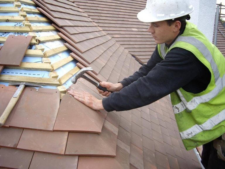 roofer in dundee repairing tiled roof